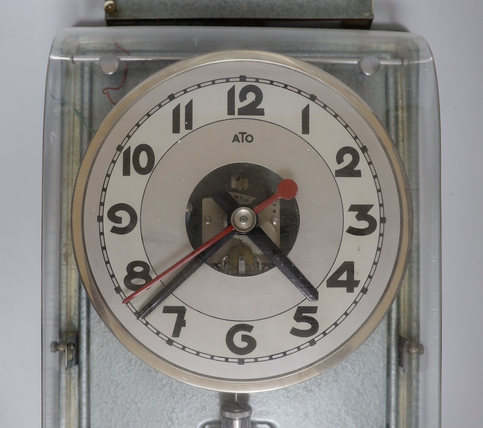 A vintage electric ATO wall clock